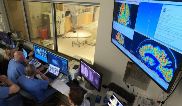 Researchers at WVU Rockefeller Neuroscience Institute in the MRI suite’s control area