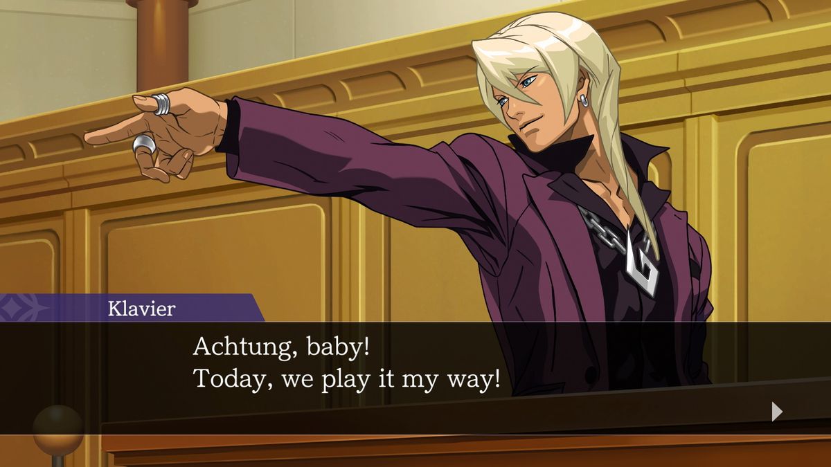 A blonde lawyer named Klavier, wearing a lot of jewelry, points and says “Achtung, baby! Today, we play it my way!” in a screencap from Apollo Justice: Ace Attorney Trilogy